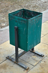 green metal trash garbage can