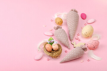 Handmade Easter concept. Sewn textile carrots with traditional decoration. Festive symbols