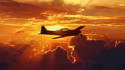 A small motor plane is silhouetted against a backdrop of cloudy skies as it travels through the...
