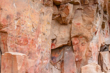 Colourful animal rockpaintings and handprints on rock walls at Cueva de las Manos, UNESCO World Heritage Site, Patagonia, Argentina