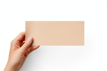 A hand holding a beige paper isolated on white background