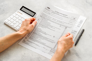 US tax forms on the table. Taxes calculating. Business and finance concept