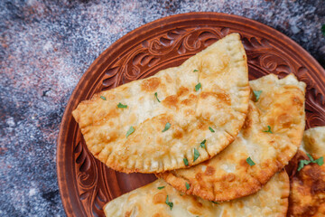 Traditional Russian deep fried meat pies - chebureki.