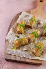 Turkish-style pistachio baklava with a glass of milk.