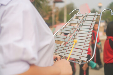 Student orchestra playing Marching Bells to play a song