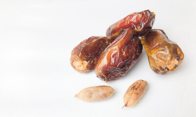 Fresh dates fruits on white background.
