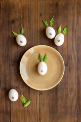 Easter bunnies made of eggs and green leaves and willow bud. Easter and spring layout