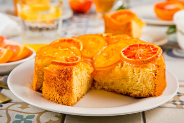 Orange cake with fruit citrus slices. Top view.