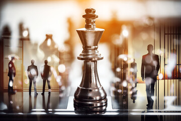 double exposure of chess piece on chess board game with silhouette business team and strategy, business success concept, business competition planning teamwork strategic concept.	
