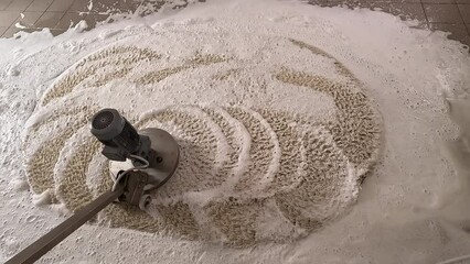 Carpets chemical cleaning with professionally disk scrubbing machine and shampoo foam. cleaning or regular clean-up.