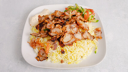 Chicken portion rice doner kebab plate top view