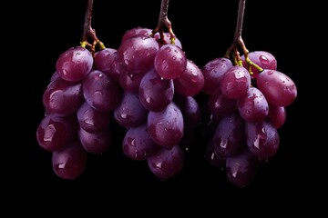 a bunch of grapes on a black background