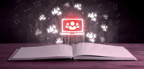 Open book with social networking icons above - 762458575
