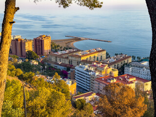 Golden hour, an aerial view of Malaga beach and downtown