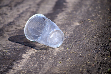 Dented plastic glass on the road