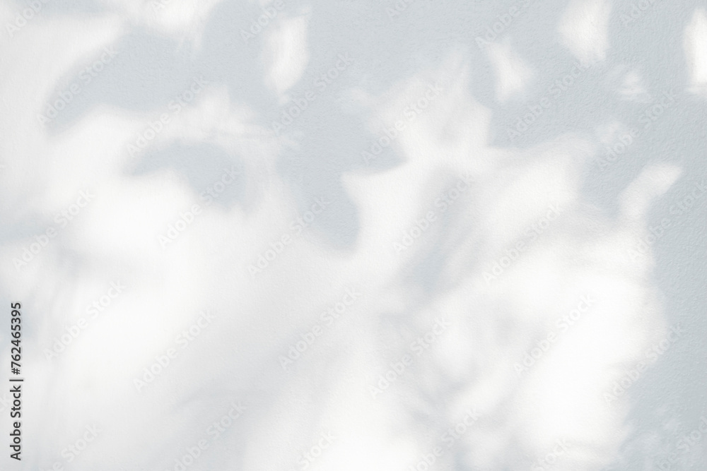 Poster abstract leaf shadow and light blurred background. natural leaves tree branch shadows and sunlight d