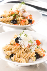 fusilli wholemeal pasta with diced seasonal vegetables with aromatic herbs and sheep's ricotta