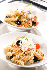 fusilli wholemeal pasta with diced seasonal vegetables with aromatic herbs and sheep's ricotta