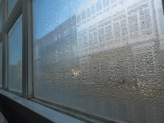 Veiled Views: Condensation on Glass Overlooking the City