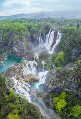 Amazing aerial view of Plitvice national park with lakes and picturesque waterfalls in a green spring forest, Croatia. - 762489923