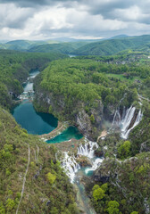 Amazing aerial view of Plitvice national park with lakes and picturesque waterfalls in a green spring forest, Croatia. - 762490385