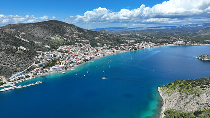 Aerial drone photo of famous seaside village small port and long sandy beach of Tolo with hotels and resorts built by the sea, Argolida, Peloponnese, Greece