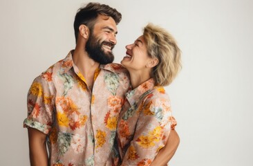 Joyful Togetherness: Couple Laughing in Colorful Embrace