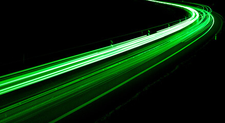 green car lights at night. long exposure