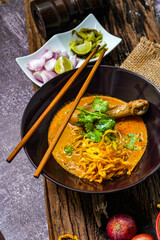 Khao Soi Thai Curry soup isolated in black background