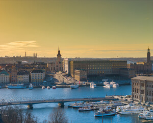 Fototapeta na wymiar Stockholm old town - Gamla stan during a sunset. Aerial view of Sweden capital. Drone top panorama photo