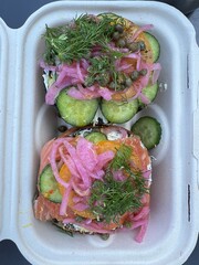Fancy fresh bagel with salmon, capers, chives, cucumber and cream cheese toppings - 762509127