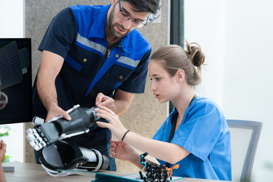Engineers, doctors and physical therapists brainstorm ideas to design a robot with arm and hand organs, To be utilized for additional testing on patients.