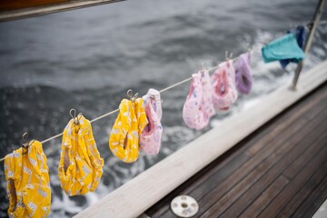 clothes drying on a washing line on a yacht boat traveling over the ocean on holiday. nappies...