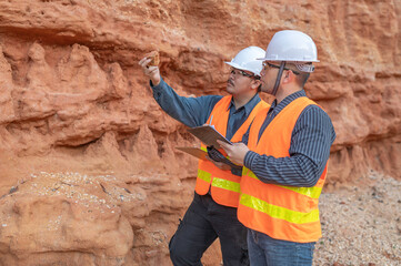 Geologist surveying mine,Explorers collect soil samples to look for minerals.