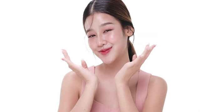 Close up portrait beautiful young Asian woman with healthy facial skin isolated over white background.
