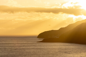 Naklejka na ściany i meble Sunset over the Atlantic Ocean, Povoacao, Sao Miguel island, Azores.