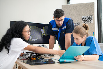 Engineers, doctors and physical therapists brainstorm ideas to design a robot with arm and hand...