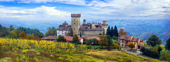 Medieval scenic villages and castles of Italy -Vigoleno with autumn vineyards in Emilia-Romagna region. - 762534588