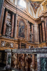 Detail of the altar of the church Santa Maria Maddalena dei Pazzi with statues and painting and blurred balustrade, Florence ITALY