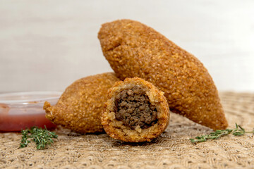 Kibbet Lebanese food, traditional Arabic snack, Kibbe is a fried recipe filled with minced meat, which is characterized by its ovoid shape finished with two pointed ends.
