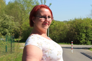Portrait of a middle-aged woman in a park in spring