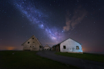 Milky Way over the abandoned buildings at the top of Picon Blanco, in Espinosa de los Monteros, Burgos, a cloudless night with a starry sky