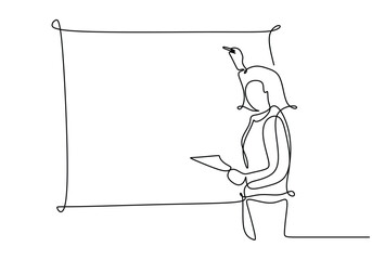 Women teacher giving a lesson in from of class behind the blackboard