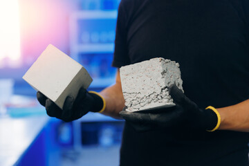 Engineer Worker hold Concrete cube in industry laboratory. Cement material after compressive strength test - obrazy, fototapety, plakaty