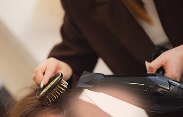 Close-up of hair dryer use hairdresser, concept barber salon, female stylist