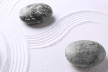 Stones on sand with pattern. Zen concept