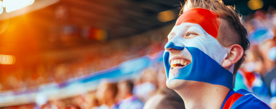 Happy Dutch male supporter with face painted in Dutch flag consists of A horizontal tricolour of red, white, and blue, Dutch male fan at a sports event such as football or rugby match
