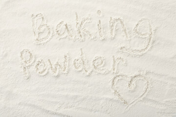 Words Baking Powder and heart written on powder, top view
