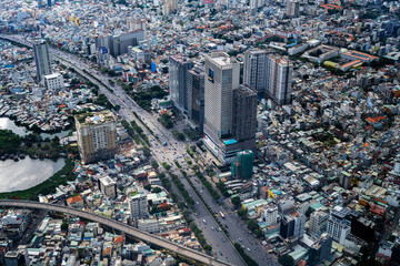 Fototapeta premium Dynamic Urban Grid: Close Aerial View Over Ho Chi Minh City's Architecture, Vietnam