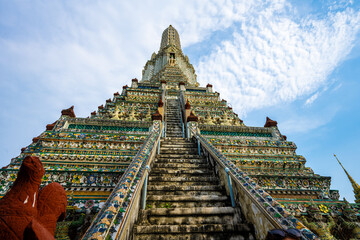 Ascending the Steep Stairs of Wat Arun, The Temple of Dawn, Bangkok, Thailand